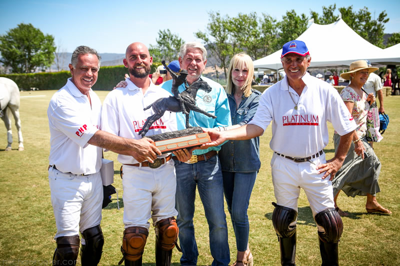 Team Platinum Performance Patrons Doug and Sue Herthel pose with Polo Classic Winners’ Trophy and team members (L to R) Carlos Gracida, T.J. Barrack, and Memo Gracida. Photos by Michael Rueter Photography